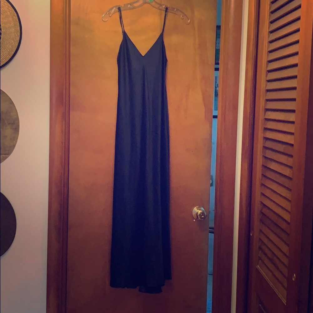 Silk slip midi dress in navy blue.
